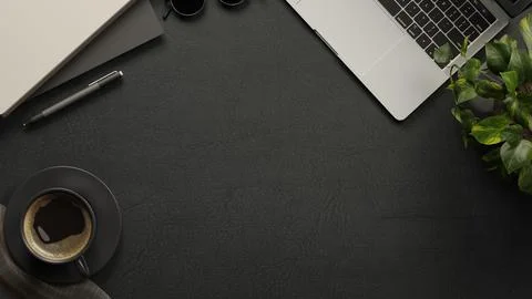 Overhead table with coffee cup, laptop, plant, pen, notebook and sunglasses.. Stock Illustration