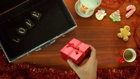 Overhead table top of Christmas decorations and Xmas gift Stock Footage 70237466