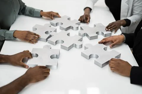 Overhead Teamwork Meeting Solving Jigsaw Puzzle Stock Photos