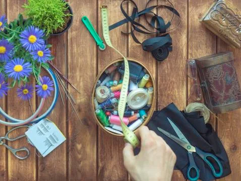 Overhead of textile workshop table hand with centimeter Фото