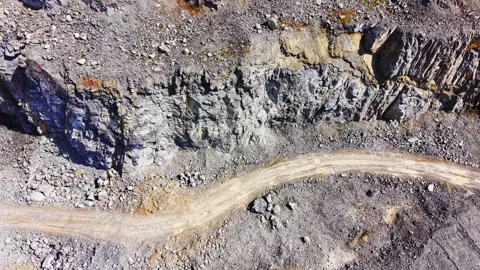 Overhead texture of layered rock quarry wall, Bulgaria 動画素材 345151148