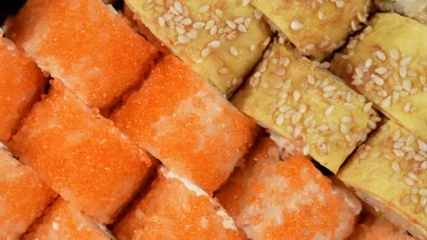 Overhead top view 4k video of assorted sushi. Rolls pattern background Stock Footage 169406691