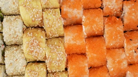 Overhead top view 4k video of assorted sushi. Rolls pattern background Stock Footage 169407539