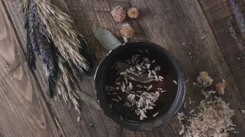 Overhead, top view shot of a medieval, herbal brew. Stock Footage 88603942
