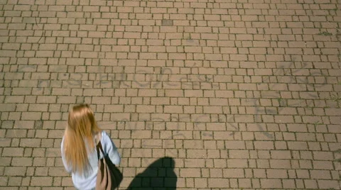 Overhead top view of Young beautiful blonde girl in summer day walks 動画素材 64533646