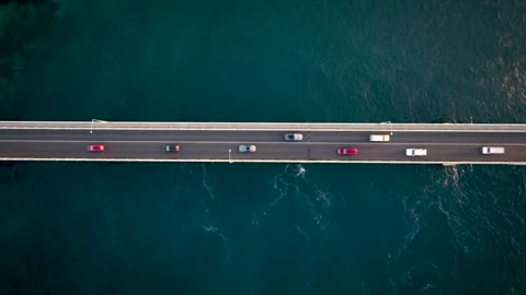 Overhead topdown drone shot of traffic on bridge 스톡 동영상 259021233