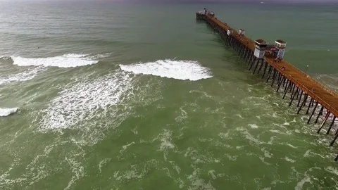 Overhead Tracking on Oceanside Pier Before Summer Storm (Aerial Drone) Stock Footage 76415418
