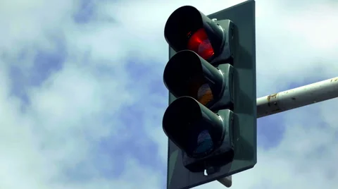 Overhead traffic light is red,then turns green Stock Footage