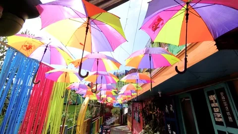 Overhead Umbrellas Decoration at Colorful Rainbow Village Jodipan Vídeo Stock 129043353
