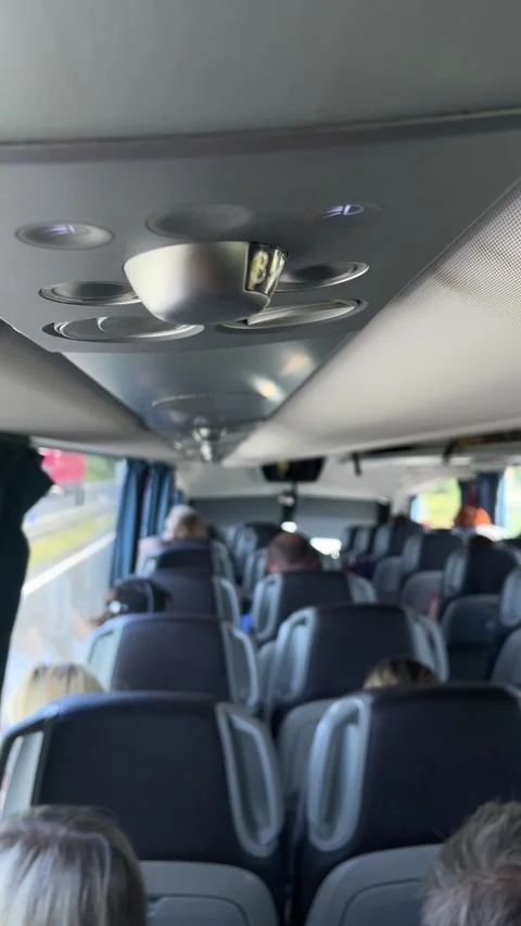 Overhead ventilation and reading light cluster inside modern passenger coach Stock Footage 344587207