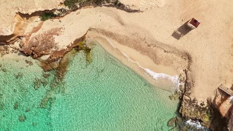 Overhead video of Cala Comte beach. Stock Footage 302103200