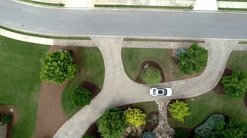 Overhead video of car leaving front circular driveway Stock Footage 93202861