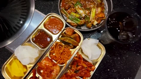 Overhead View of Asian Restaurant Table with Stir Fry and Kimchi Stock Footage 339065370