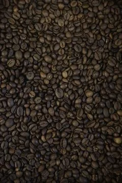 Overhead view of backdrop representing halves of dark brown coffee beans. Tex Stock-Fotos