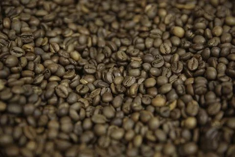 Overhead view of backdrop representing halves of dark brown coffee beans. Tex Foto stock