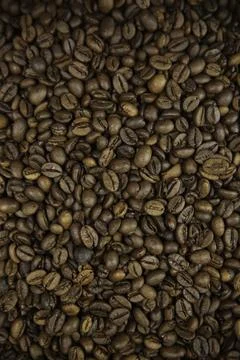 Overhead view of backdrop representing halves of dark brown coffee beans. Tex Stock Photos
