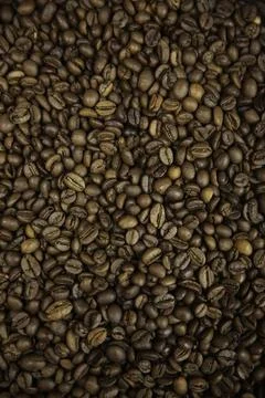 Overhead view of backdrop representing halves of dark brown coffee beans. Tex Stock Photos