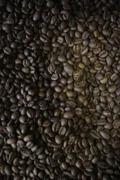 Overhead view of backdrop representing halves of dark brown coffee beans. Tex Фото