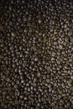 Overhead view of backdrop representing halves of dark brown coffee beans. Tex Foto stock