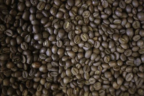 Overhead view of backdrop representing halves of dark brown coffee beans. Tex Stock Photos