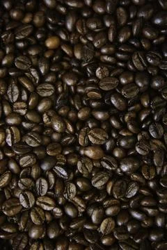 Overhead view of backdrop representing halves of dark brown coffee beans. Tex Stock Photos
