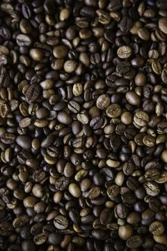 Overhead view of backdrop representing halves of dark brown coffee beans. Tex Foto stock