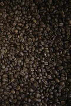 Overhead view of backdrop representing halves of dark brown coffee beans. Tex Foto stock
