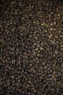 Overhead view of backdrop representing halves of dark brown coffee beans. Tex Foto stock