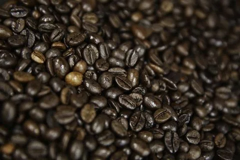 Overhead view of backdrop representing halves of dark brown coffee beans. Tex Stock Photos
