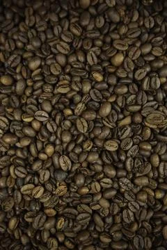 Overhead view of backdrop representing halves of dark brown coffee beans. Tex Фото