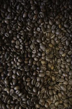 Overhead view of backdrop representing halves of dark brown coffee beans. Tex Stock Photos