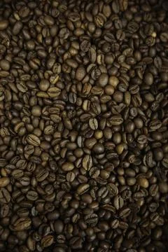 Overhead view of backdrop representing halves of dark brown coffee beans. Tex Stock Photos
