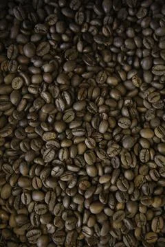 Overhead view of backdrop representing halves of dark brown coffee beans. Tex Foto stock