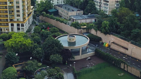 Overhead view of the backyard of a multi-storey building after rain with walk Stock Footage 157889934