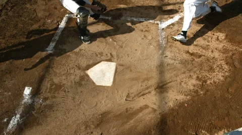 Overhead view of baseball player sliding into home plate Stock Footage