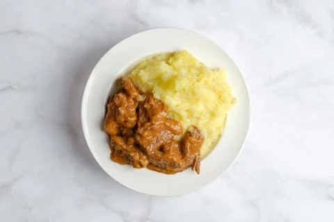 Overhead view of beef goulash with mashed potato Stock Photos
