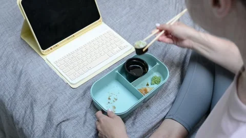 Overhead view from behind a womans head as she watches content on a tablet Stock-Footage 346845871