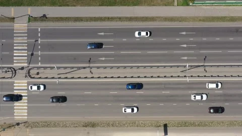Overhead view of black and white cars moving along the multilane highway 動画素材 205076858