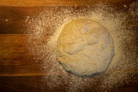 Overhead view of bread dough ball on a wooden cutting board with flour Copyspace Stock Photos