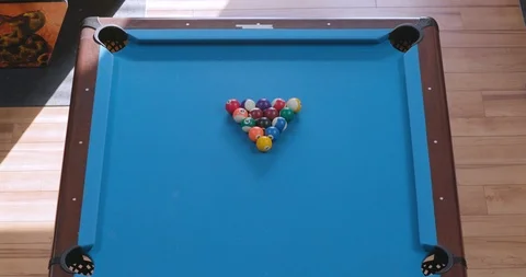 Overhead View of Breaking Racked Pool Balls in Eight-Ball Formation on Blue Vídeo Stock 88227409
