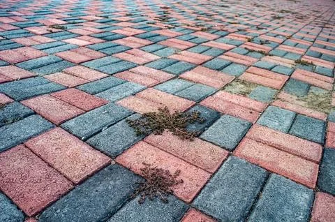 Overhead view of a brick paved surface with a repeating pattern of red and .. Stock Photos