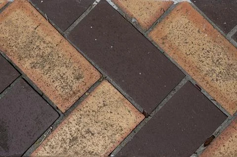 Overhead view of bricks arranged in a herringbone pattern 스톡 사진