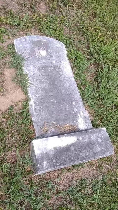 Overhead View of a Broken Old Gravestone Stock Footage 282101562