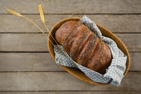Overhead view of brown bread in basket Stock Photos