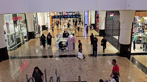 Overhead view of a busy mall of the Emirates Customers are seen walking Stock Footage 311767299