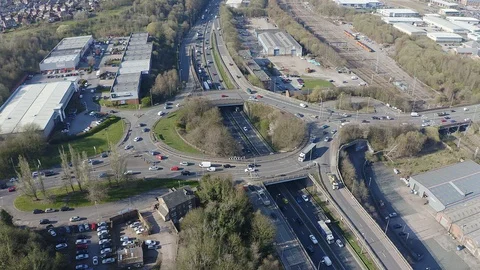 Overhead view of a busy roundabout in the midlands, motorway traffic Stock Footage 105510201