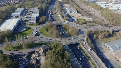 Overhead view of a busy roundabout in the midlands, motorway traffic Stock Footage 105510233