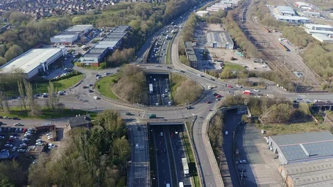 Overhead view of a busy roundabout in the midlands, motorway traffic Stock Footage 105510358