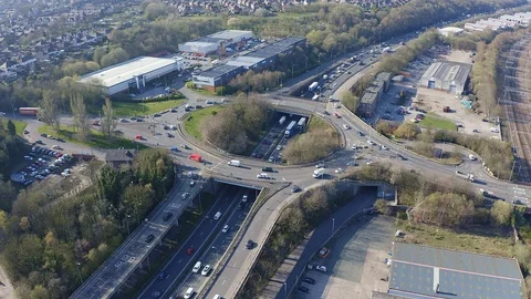 Overhead view of a busy roundabout in the midlands, motorway traffic Stock Footage 105510407