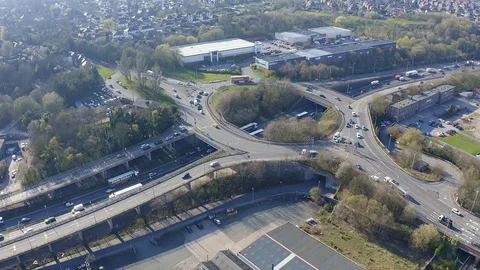 Overhead view of a busy roundabout in the midlands, motorway traffic Stock Footage 105510471